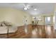 Open living area with hardwood floors and plenty of natural light at 1494 Walnut Way, The Villages, FL 32163