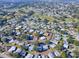 Aerial view of a 55+ community, showing numerous homes and lush landscaping at 1611 Cherry Hill Rd, The Villages, FL 32159