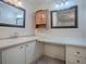 Bathroom with double vanity and a large medicine cabinet at 1611 Cherry Hill Rd, The Villages, FL 32159