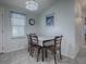Cozy dining area with table and four chairs at 1611 Cherry Hill Rd, The Villages, FL 32159