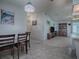 Open concept living and dining area with view into kitchen at 1611 Cherry Hill Rd, The Villages, FL 32159
