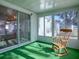 Sunroom with rocking chair and view of backyard at 1611 Cherry Hill Rd, The Villages, FL 32159