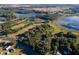 Aerial view of property showing expansive land and lake views at 19010 County Road 42, Altoona, FL 32702