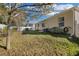 Large backyard with grassy area and privacy fence at 2354 Valhalla Dr, Tavares, FL 32778