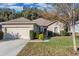 One-story house with attached garage and landscaped front yard at 2354 Valhalla Dr, Tavares, FL 32778