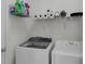 Laundry room with washer, dryer, and shelving for storage at 2354 Valhalla Dr, Tavares, FL 32778