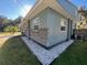 Side view of the house, showcasing stone accents and landscaping at 2478 Cr 447, Lake Panasoffkee, FL 33538