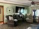 Bright living room with large TV, comfy seating and dining area at 2478 Cr 447, Lake Panasoffkee, FL 33538