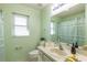 Light green bathroom with shower/tub combo at 26939 Forest Hills St, Leesburg, FL 34748