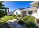 House exterior with walkway, landscaping, and American flag at 26939 Forest Hills St, Leesburg, FL 34748