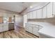 White kitchen with ample counter and cabinet space at 26939 Forest Hills St, Leesburg, FL 34748