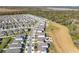 Aerial view of a new home community with many houses and green spaces at 30224 Armenia Rd, Leesburg, FL 34748