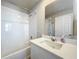 Clean bathroom with white vanity and bathtub at 30224 Armenia Rd, Leesburg, FL 34748