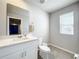 Simple bathroom with white vanity and toilet at 30224 Armenia Rd, Leesburg, FL 34748