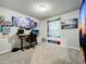 Home office with standing desk and wall art at 30224 Armenia Rd, Leesburg, FL 34748