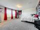 Cozy bedroom with a large bed and Chicago Cubs themed decor at 30224 Armenia Rd, Leesburg, FL 34748