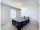 Simple bedroom with window and gray blanket at 30224 Armenia Rd, Leesburg, FL 34748