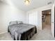 Cozy bedroom with double closet and gray blanket at 30224 Armenia Rd, Leesburg, FL 34748