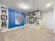 Spacious game room with New York Rangers theme and plenty of wall space for displaying memorabilia at 30224 Armenia Rd, Leesburg, FL 34748