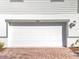 White garage door with paver driveway at 30224 Armenia Rd, Leesburg, FL 34748