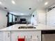 Kitchen island with double sink overlooking living room at 30224 Armenia Rd, Leesburg, FL 34748