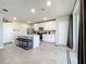 Modern kitchen with white cabinets, stainless steel appliances, and an island at 30224 Armenia Rd, Leesburg, FL 34748