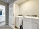 Bright laundry room with washer and dryer at 30224 Armenia Rd, Leesburg, FL 34748