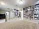 Upstairs hallway with carpeted floor and hockey memorabilia at 30224 Armenia Rd, Leesburg, FL 34748