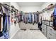 Spacious walk-in closet with custom shelving and hanging rods at 30224 Armenia Rd, Leesburg, FL 34748