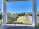 Private balcony with views of trees and the community at 30812 Top Of The Hill Dr, Mount Dora, FL 32757