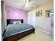 Spacious bedroom with a king-size bed and lots of closet space at 30812 Top Of The Hill Dr, Mount Dora, FL 32757