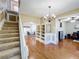 Bright entryway with hardwood floors, built-in shelving, and a staircase at 30812 Top Of The Hill Dr, Mount Dora, FL 32757