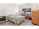 Bedroom with a double bed, lake view, and built-in shelving at 38230 Yale Cir, Leesburg, FL 34788