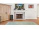 Elegant fireplace with mantel and built-in storage at 38230 Yale Cir, Leesburg, FL 34788