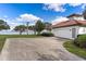 Detached garage with lake view and spacious driveway at 38230 Yale Cir, Leesburg, FL 34788