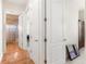 Hallway with light walls and tile floors, bedrooms and bathroom access at 38230 Yale Cir, Leesburg, FL 34788