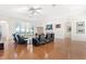 Large living room with hardwood floors, fireplace, and water views at 38230 Yale Cir, Leesburg, FL 34788