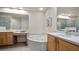 Bathroom with double vanity, soaking tub, and walk-in shower at 41 Camino Real Blvd # 41, Howey In The Hills, FL 34737