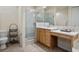Bathroom with double vanity, walk-in shower, and toilet at 41 Camino Real Blvd # 41, Howey In The Hills, FL 34737