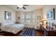 Spacious bedroom with wood floors, window seat, and dresser at 41 Camino Real Blvd # 41, Howey In The Hills, FL 34737