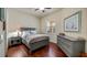 Cozy bedroom with gray furniture and wood floors at 41 Camino Real Blvd # 41, Howey In The Hills, FL 34737