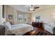 Spacious bedroom with wood floors, window seat, and dresser at 41 Camino Real Blvd # 41, Howey In The Hills, FL 34737