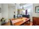 Bright dining area with wooden table, chairs and view of entry at 41 Camino Real Blvd # 41, Howey In The Hills, FL 34737