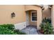Inviting entryway with brick-paved walkway and landscaping at 41 Camino Real Blvd # 41, Howey In The Hills, FL 34737