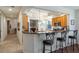 Kitchen boasts a breakfast bar with granite counters and stylish seating at 41 Camino Real Blvd # 41, Howey In The Hills, FL 34737