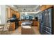 Modern kitchen with granite countertops, stainless steel appliances, and an island at 41 Camino Real Blvd # 41, Howey In The Hills, FL 34737
