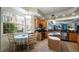 Eat-in kitchen with granite counters, wood cabinets, and a breakfast nook at 41 Camino Real Blvd # 41, Howey In The Hills, FL 34737