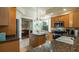 Well-equipped kitchen, granite counters, breakfast bar, and ample cabinetry at 41 Camino Real Blvd # 41, Howey In The Hills, FL 34737