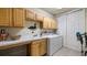 Laundry room with washer, dryer, cabinets, and sink at 41 Camino Real Blvd # 41, Howey In The Hills, FL 34737