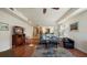 Spacious living room with hardwood floors, a cozy seating area, and large windows at 41 Camino Real Blvd # 41, Howey In The Hills, FL 34737